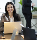 close-up-smiley-woman-with-laptop
